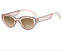 Load image into Gallery viewer, Sunglasses with a transparent frame and brown gradient lenses on a white background.
